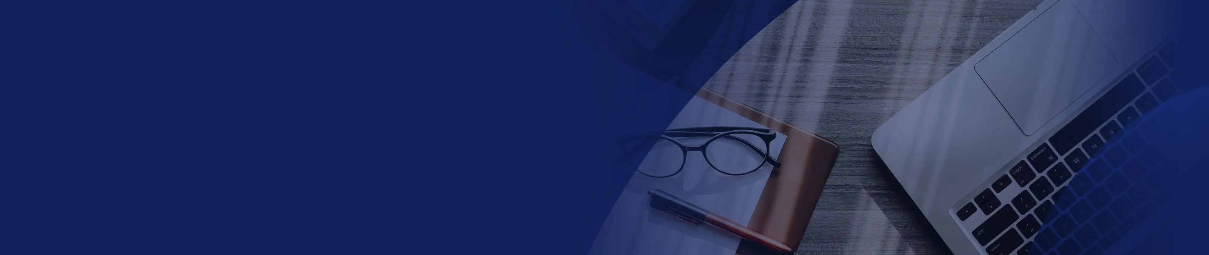 Laptop, glasses and pen